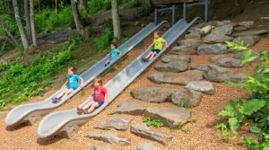 Commercial embankment slides in heavy-duty roto-molded plastic for preschools and daycares